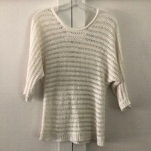 White short sleeve light sweater.